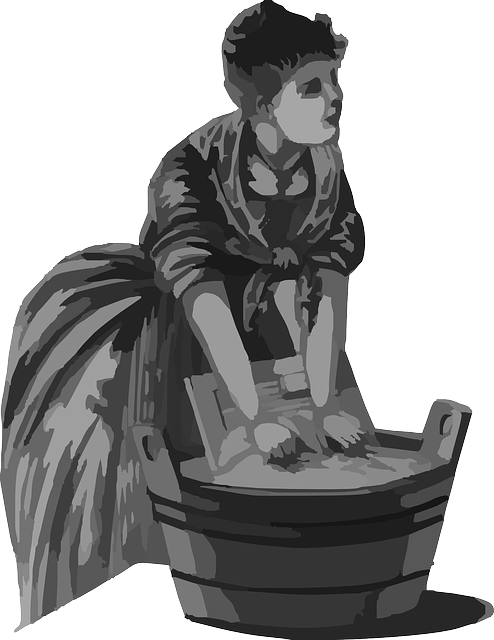 woman washing clothes in bucket